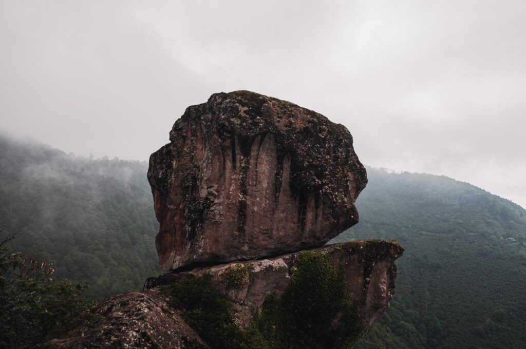 two big rocks on top of each other. cliff landscape.